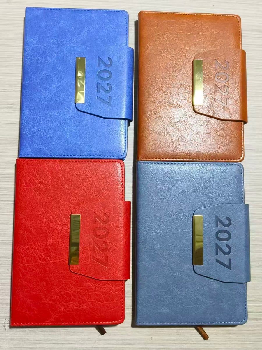 2027 diaries with gold metal clasp in blue, tan, red and dusty-blue