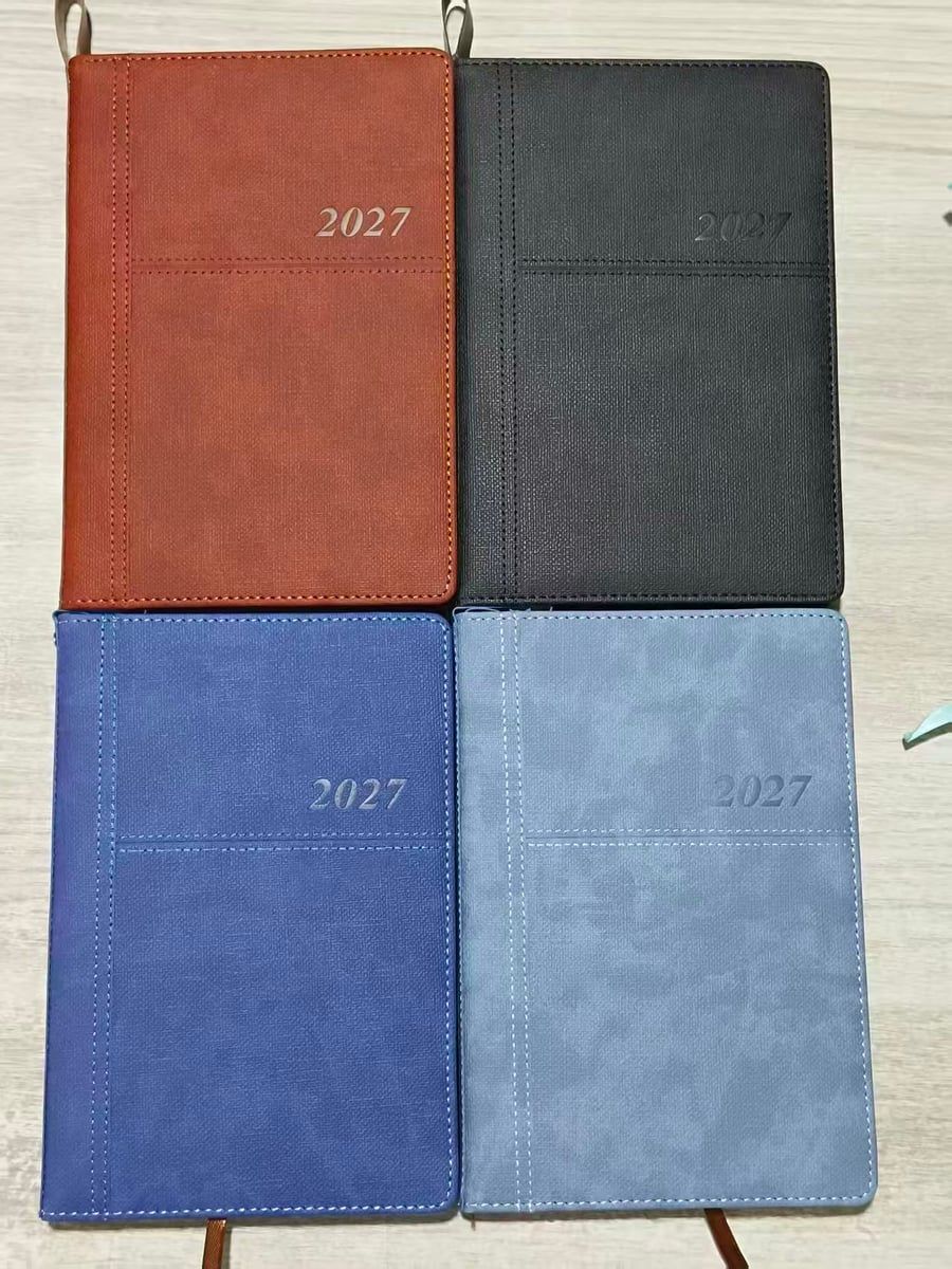 2027 dated diaries in tan, black, blue and dusty-blue textured PU covers